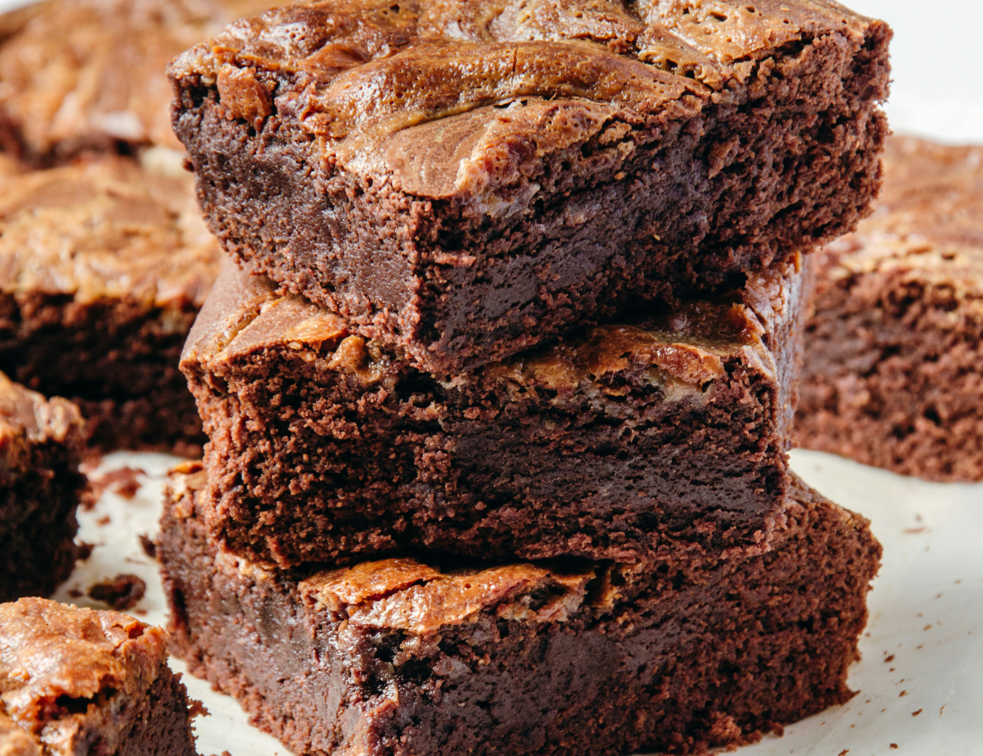 stack of brownies on a white napkin